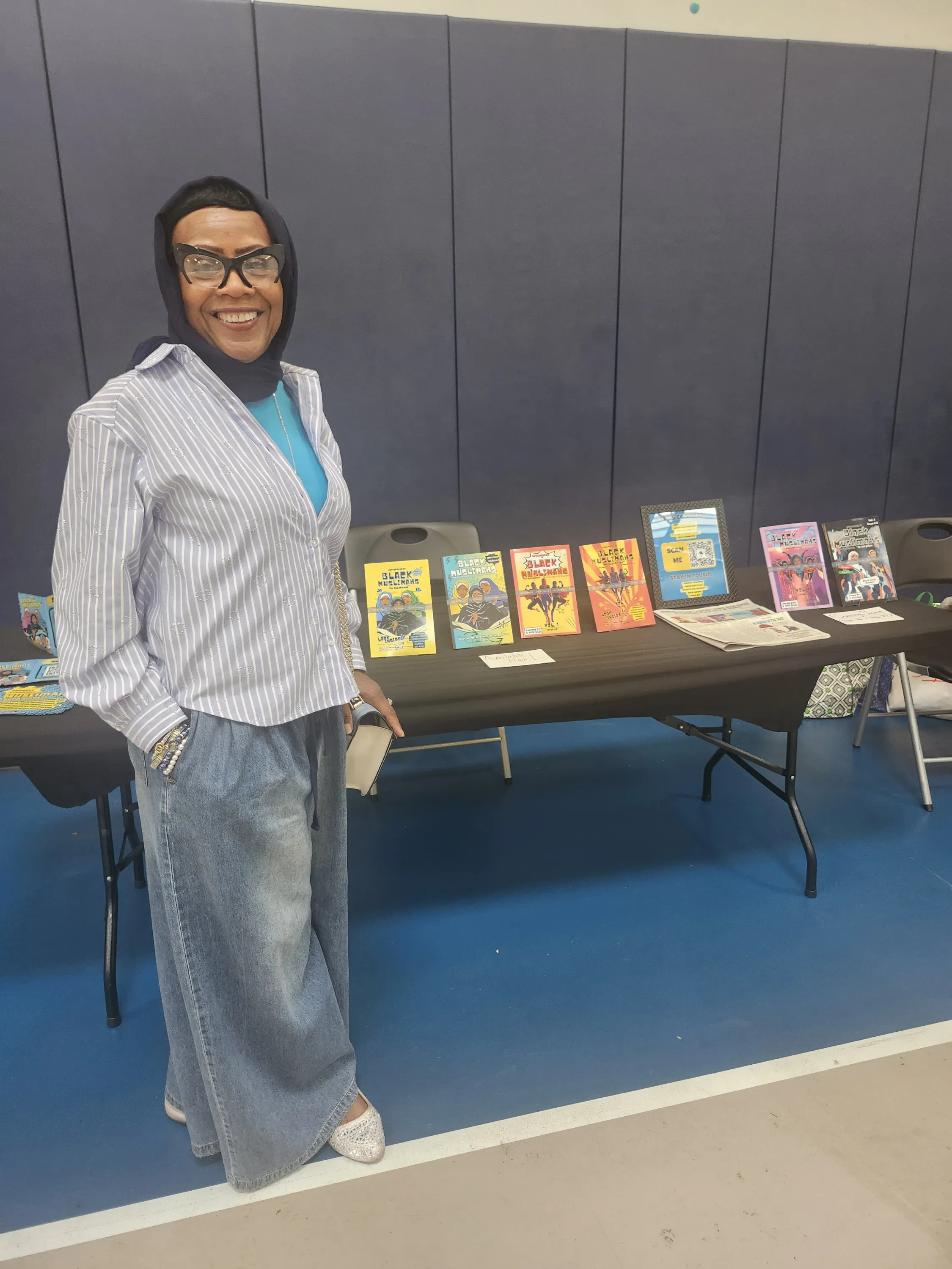 Ebony Reverie Comics at a community vending event, Adventures of Black Muslimahs issues on display