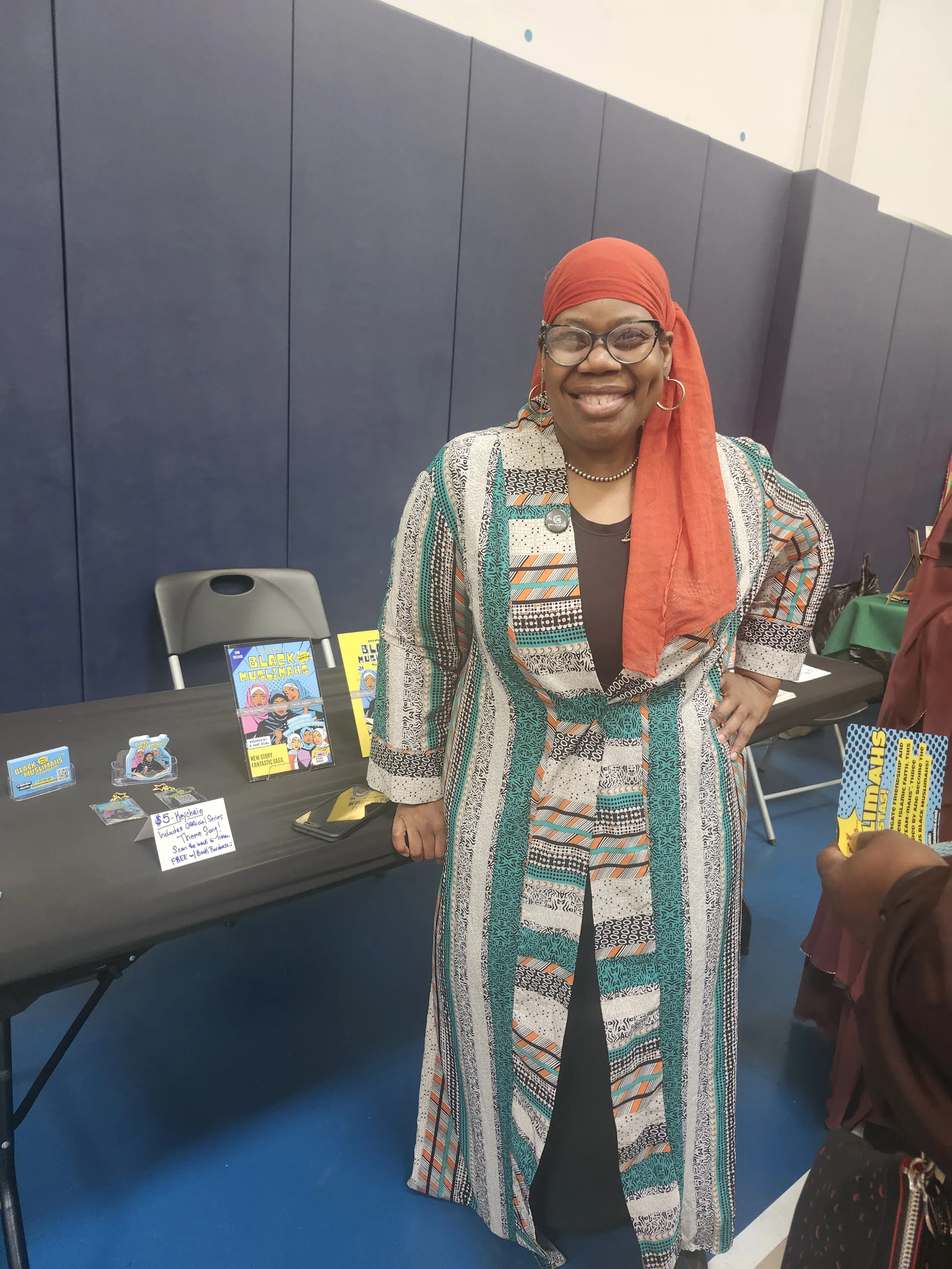 Ebony Reverie Comics vendor table with comic issues and keychains