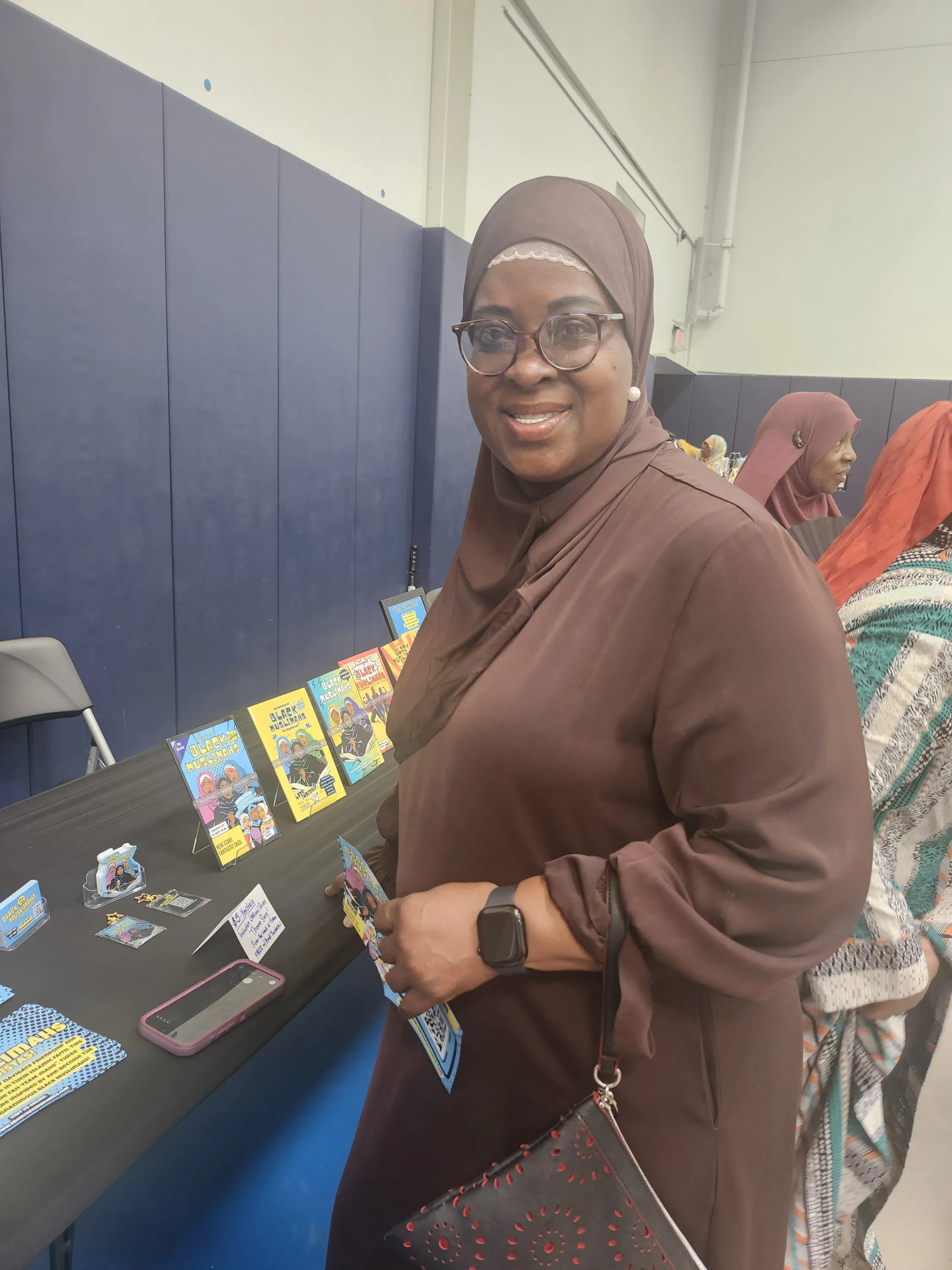 Vendor table featuring Adventures of Black Muslimahs comic series